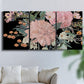 Three-panel canvas wall art featuring dark floral night blossoms, displayed in a living room above a sofa.