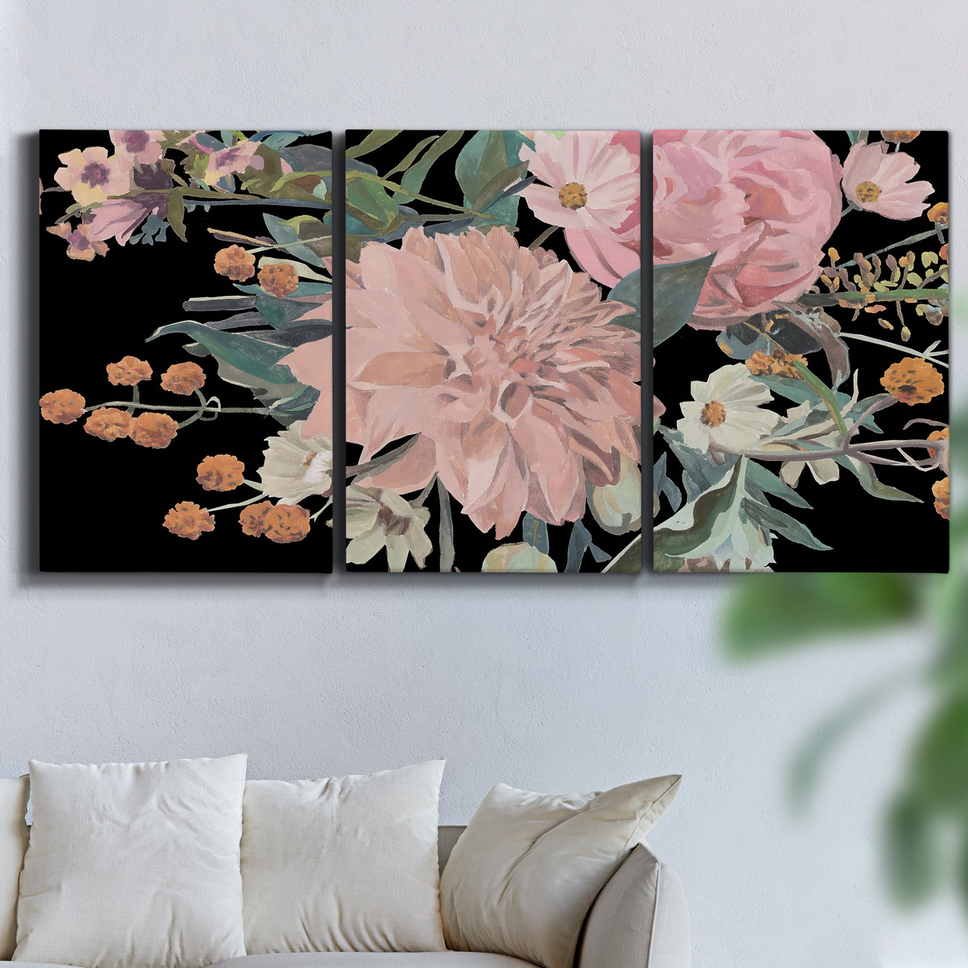 Three-panel canvas wall art featuring dark floral night blossoms, displayed in a living room above a sofa.