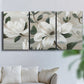 Three-panel canvas wall art featuring soft southern floral charm, displayed in a living room above a sofa.
