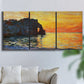 Three-panel canvas wall art featuring arched coastal cliff above sea, displayed in a living room above a sofa.