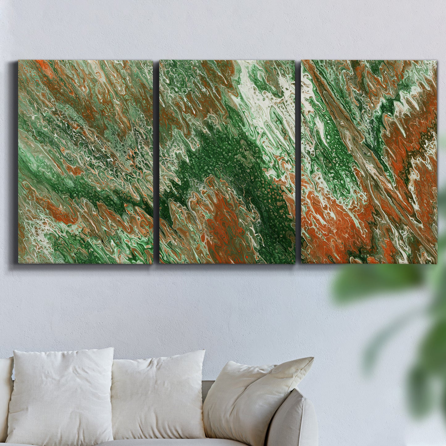 Three-panel canvas wall art featuring modern abstract layered pattern, displayed in a living room above a sofa.