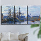 Three-panel canvas wall art featuring industrial dock along harbor, displayed in a living room above a sofa.