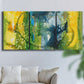 Three-panel canvas wall art featuring energetic abstract aquatic color motion, displayed in a living room above a sofa.