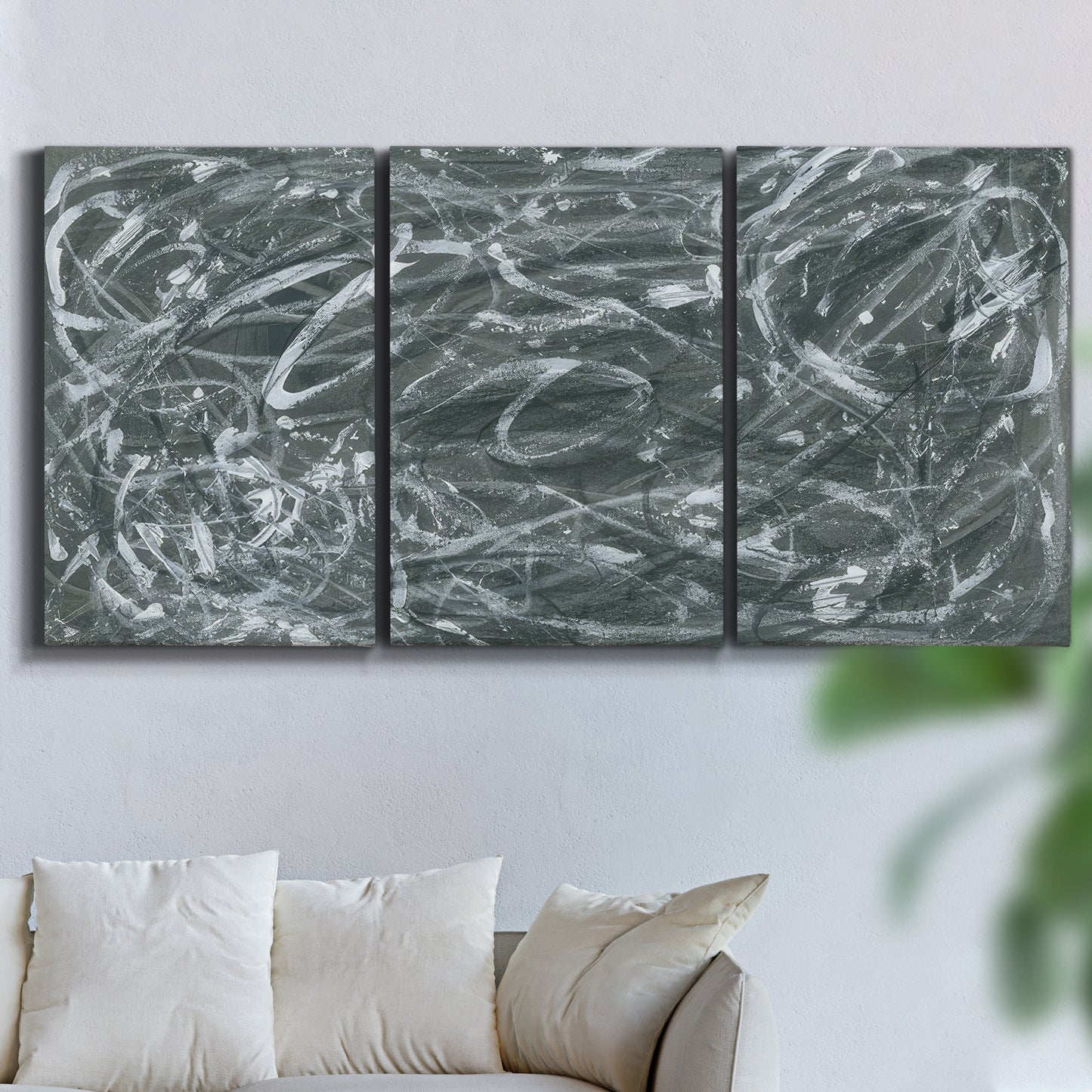 Three-panel canvas wall art featuring abstract view through window forms, displayed in a living room above a sofa.