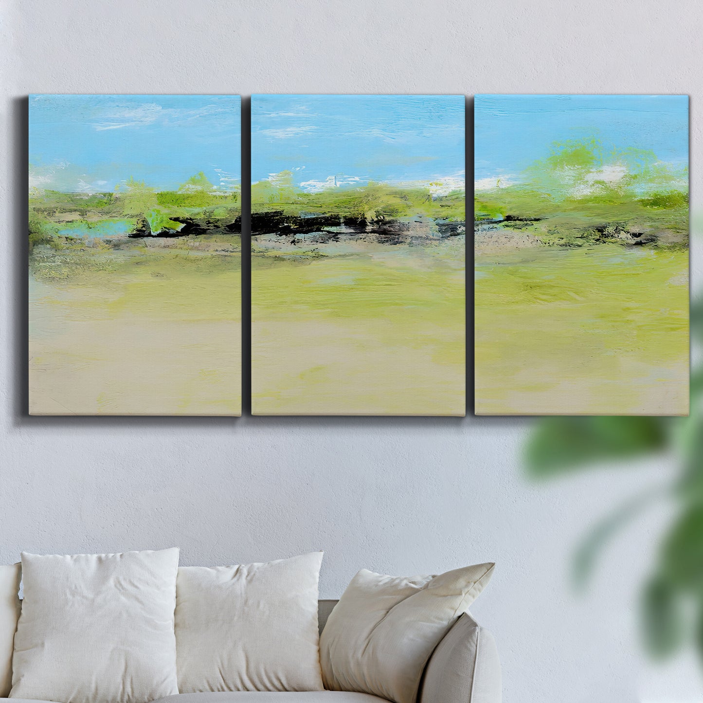 Three-panel canvas wall art featuring abstract terrace landscape view, displayed in a living room above a sofa.