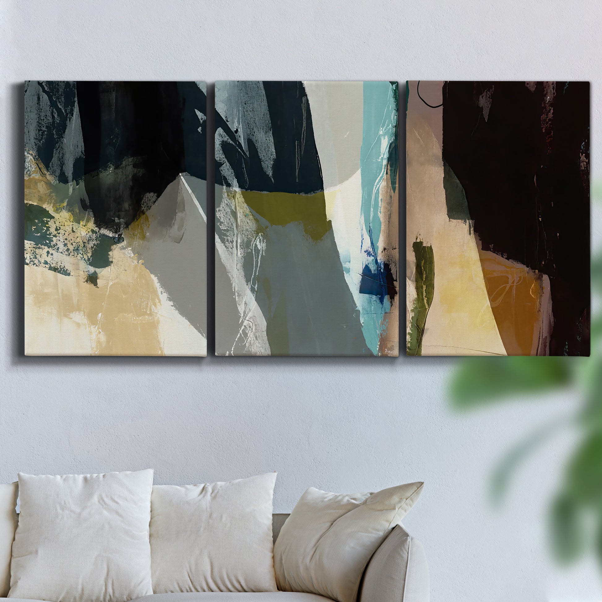 Three-panel canvas wall art featuring layered neutral abstract textures, displayed in a living room above a sofa.