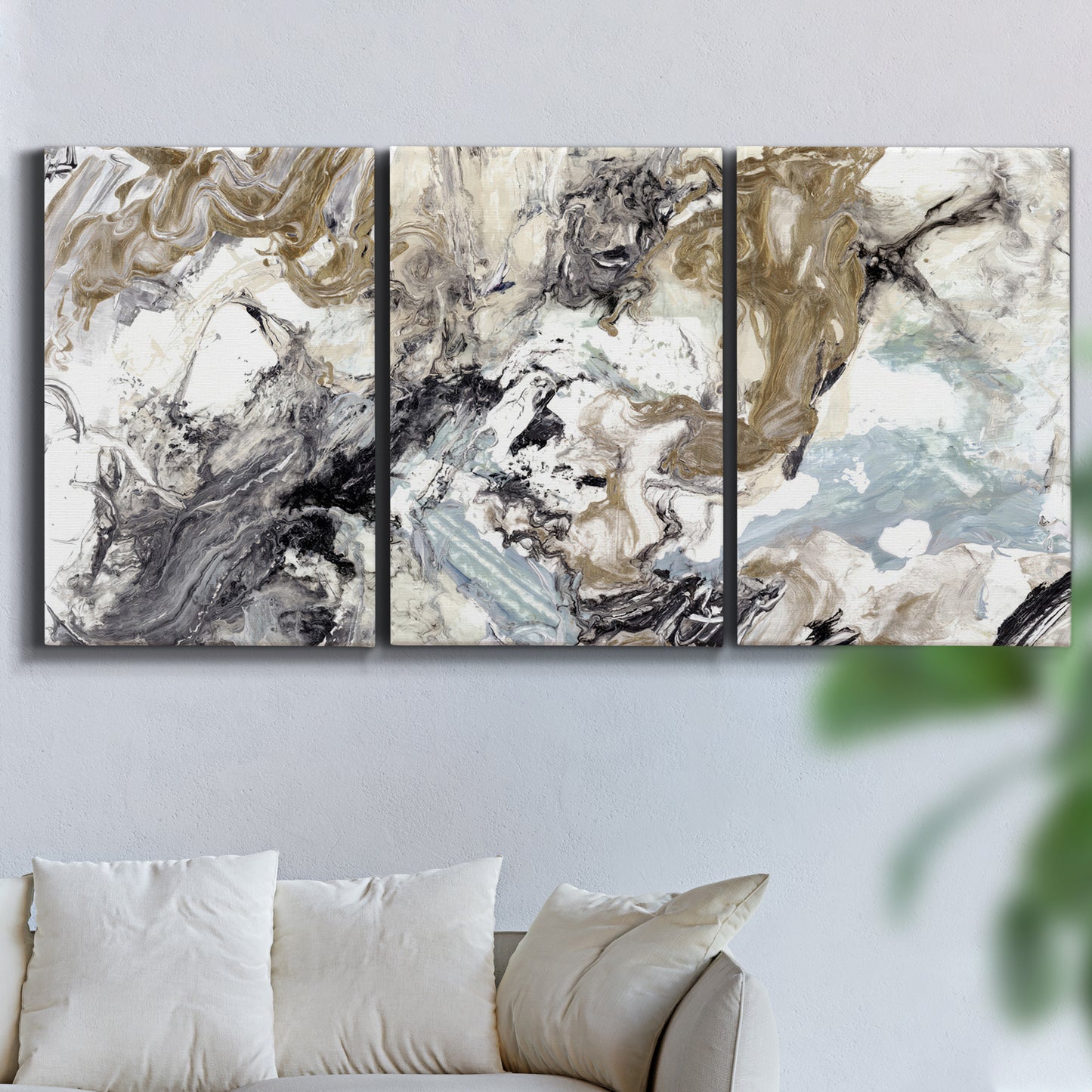 Three-panel canvas wall art featuring marbled modern abstract textures, displayed in a living room above a sofa.