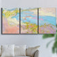 Three-panel canvas wall art featuring geometric mid century abstract blocks, displayed in a living room above a sofa.