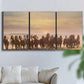 Three-panel canvas wall art featuring running horses captured in motion, displayed in a living room above a sofa.