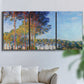 Three-panel canvas wall art featuring autumn poplar trees along river, displayed in a living room above a sofa.