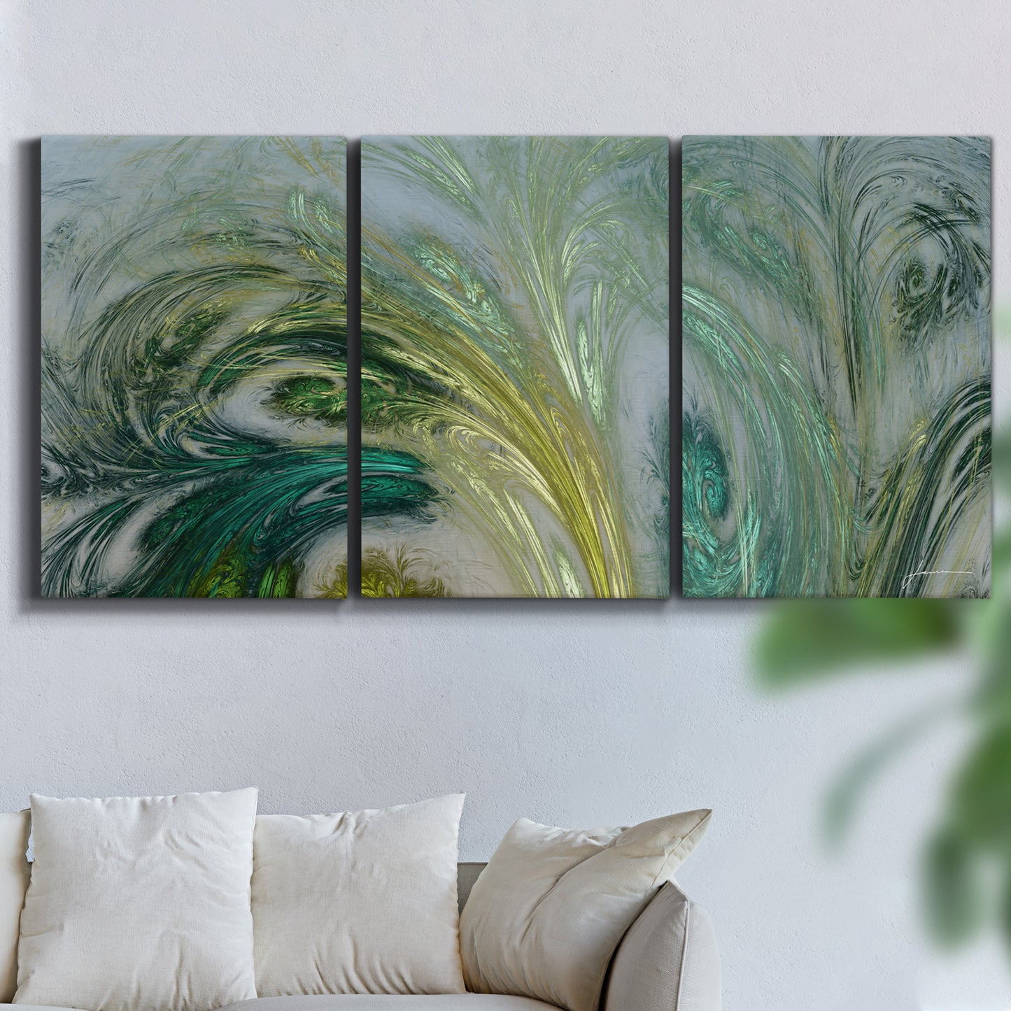 Three-panel canvas wall art featuring layered modern abstract landscape, displayed in a living room above a sofa.