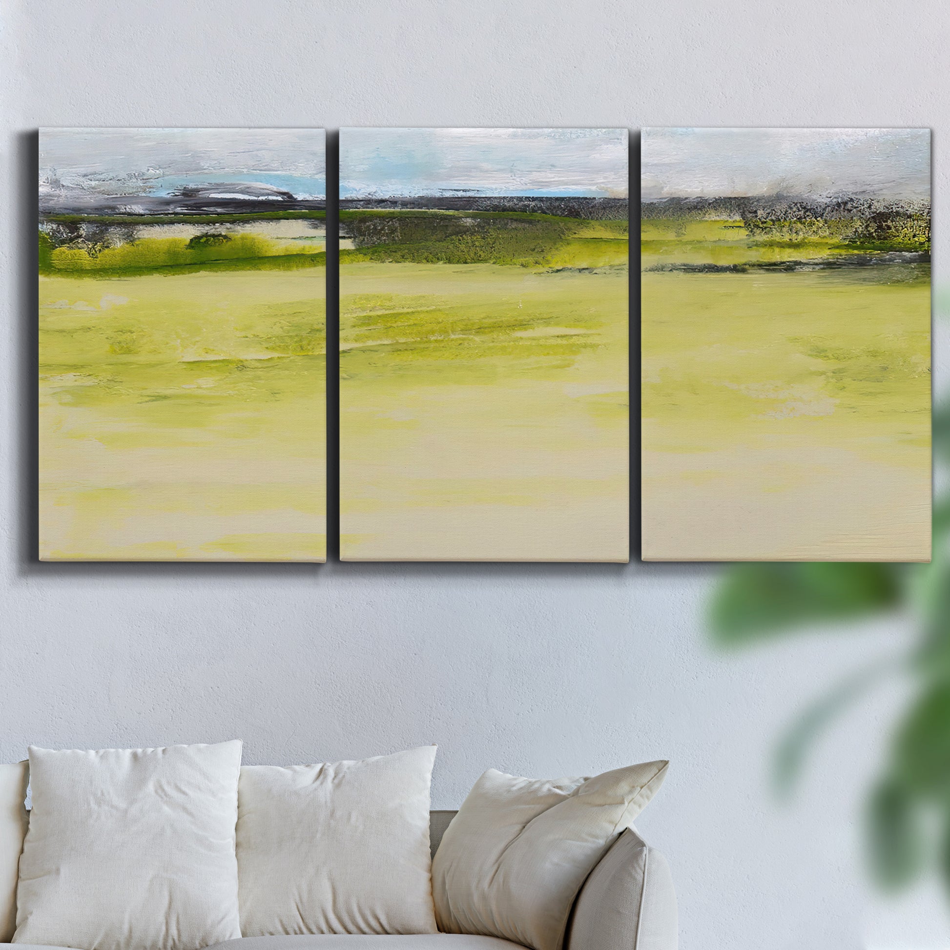 Three-panel canvas wall art featuring abstract terrace landscape view, displayed in a living room above a sofa.