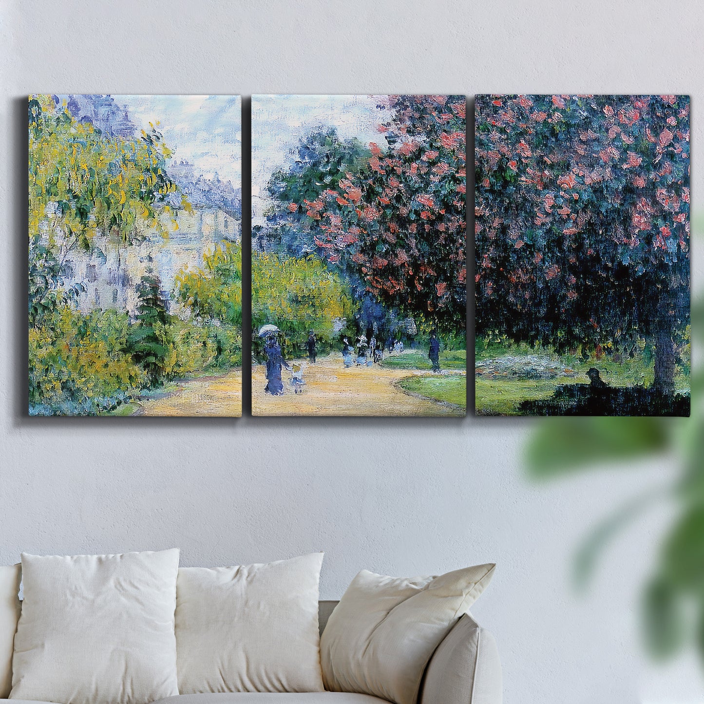 Three-panel canvas wall art featuring formal city park with trees, displayed in a living room above a sofa.