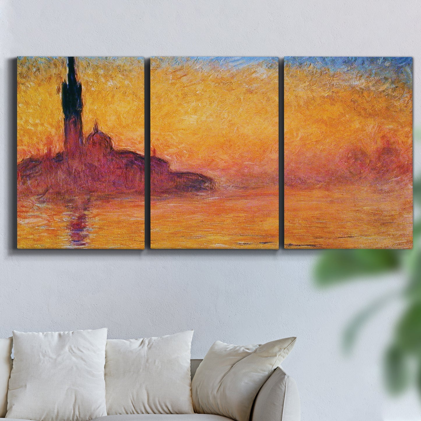 Three-panel canvas wall art featuring venetian church at twilight, displayed in a living room above a sofa.