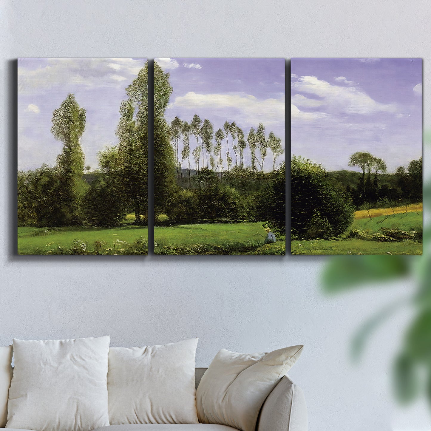Three-panel canvas wall art featuring open landscape near le havre, displayed in a living room above a sofa.