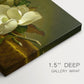 Canvas art print of magnolia blossoms arranged on gold velvet surface, highlighting texture and gallery-wrapped edges