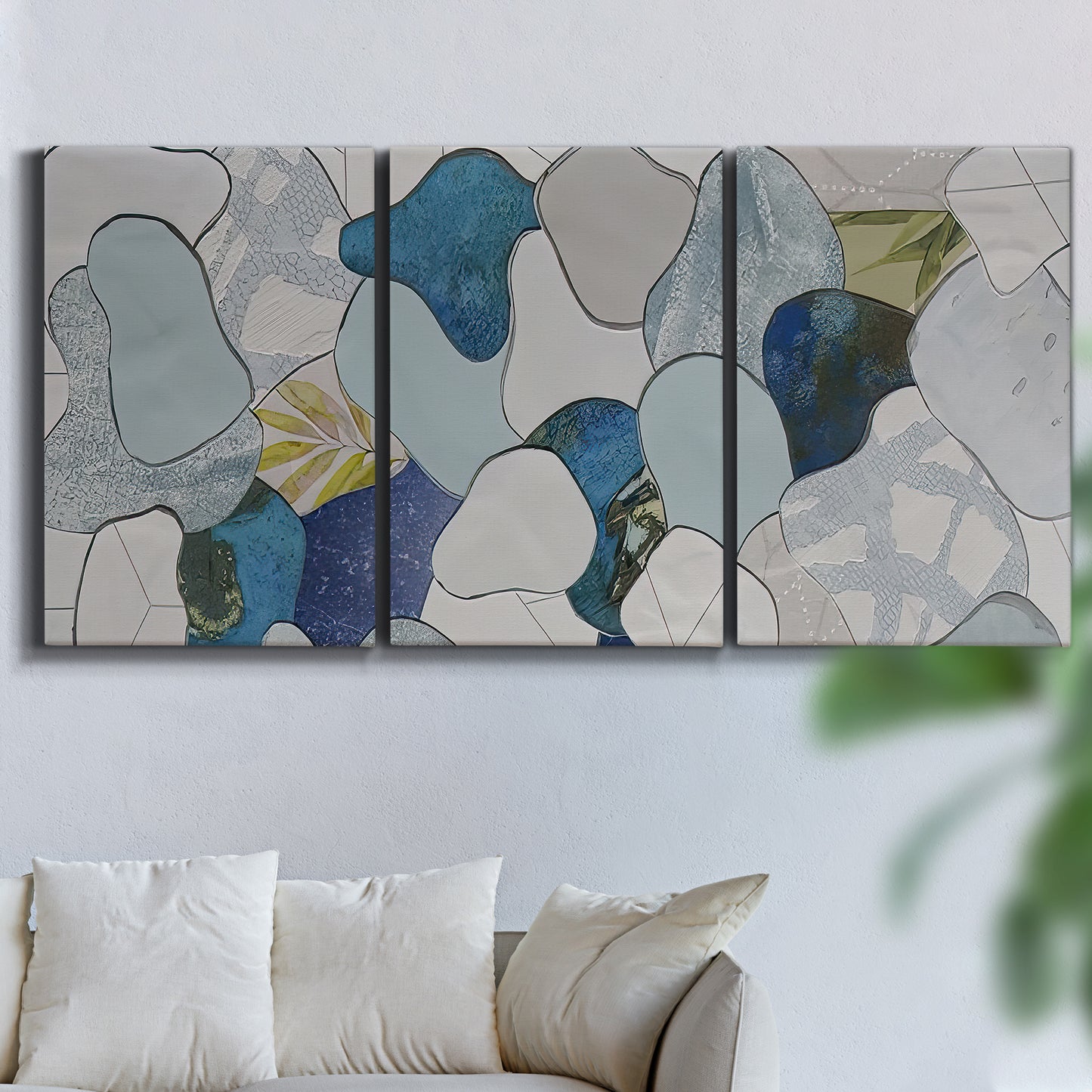 Three-panel canvas wall art featuring mid century geometric pink abstraction, displayed in a living room above a sofa.