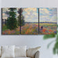 Three-panel canvas wall art featuring poppy field in open countryside, displayed in a living room above a sofa.