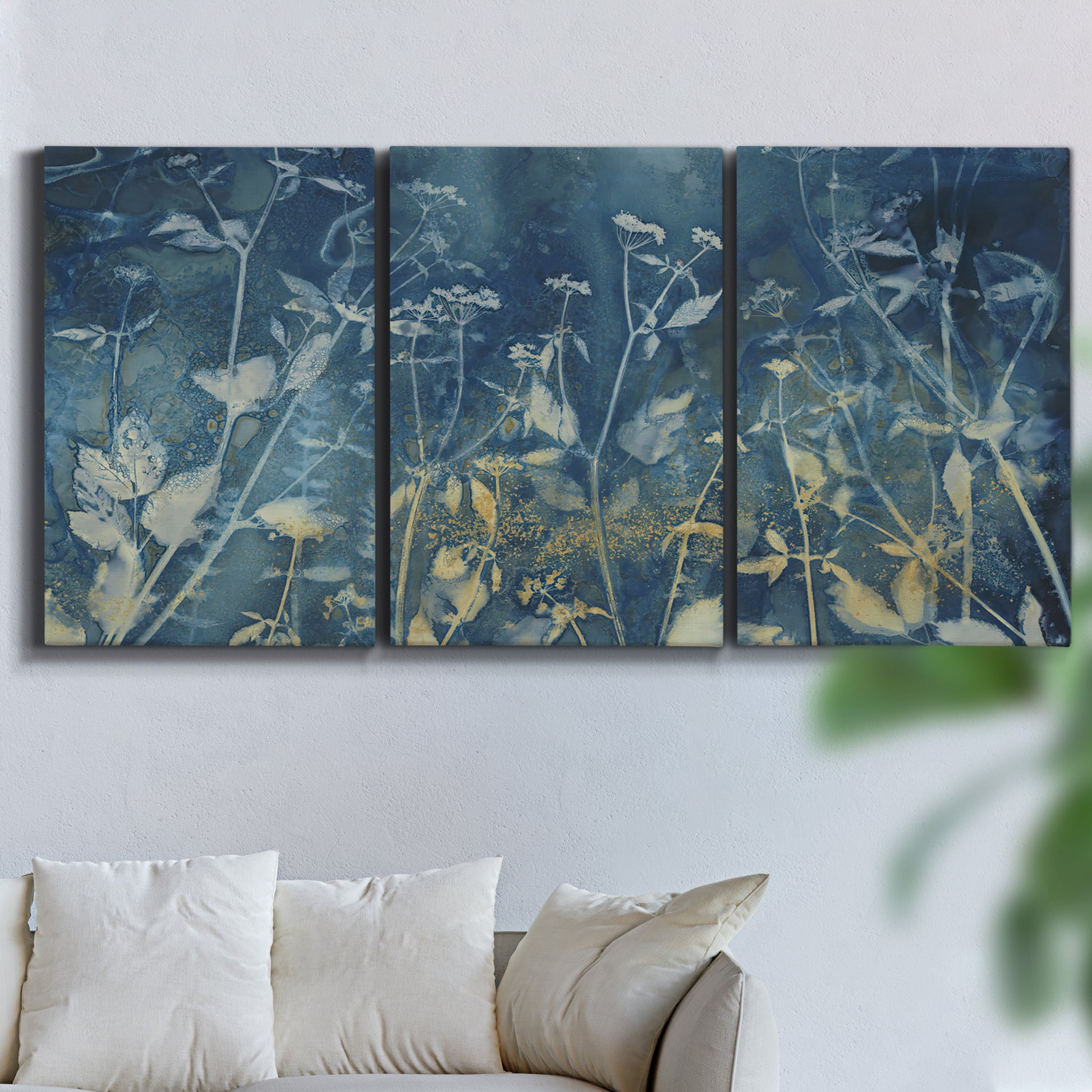 Three-panel canvas wall art featuring dark abstract with rich tonal depth, displayed in a living room above a sofa.