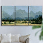 Three-panel canvas wall art featuring rural farmland landscape in watercolor, displayed in a living room above a sofa.