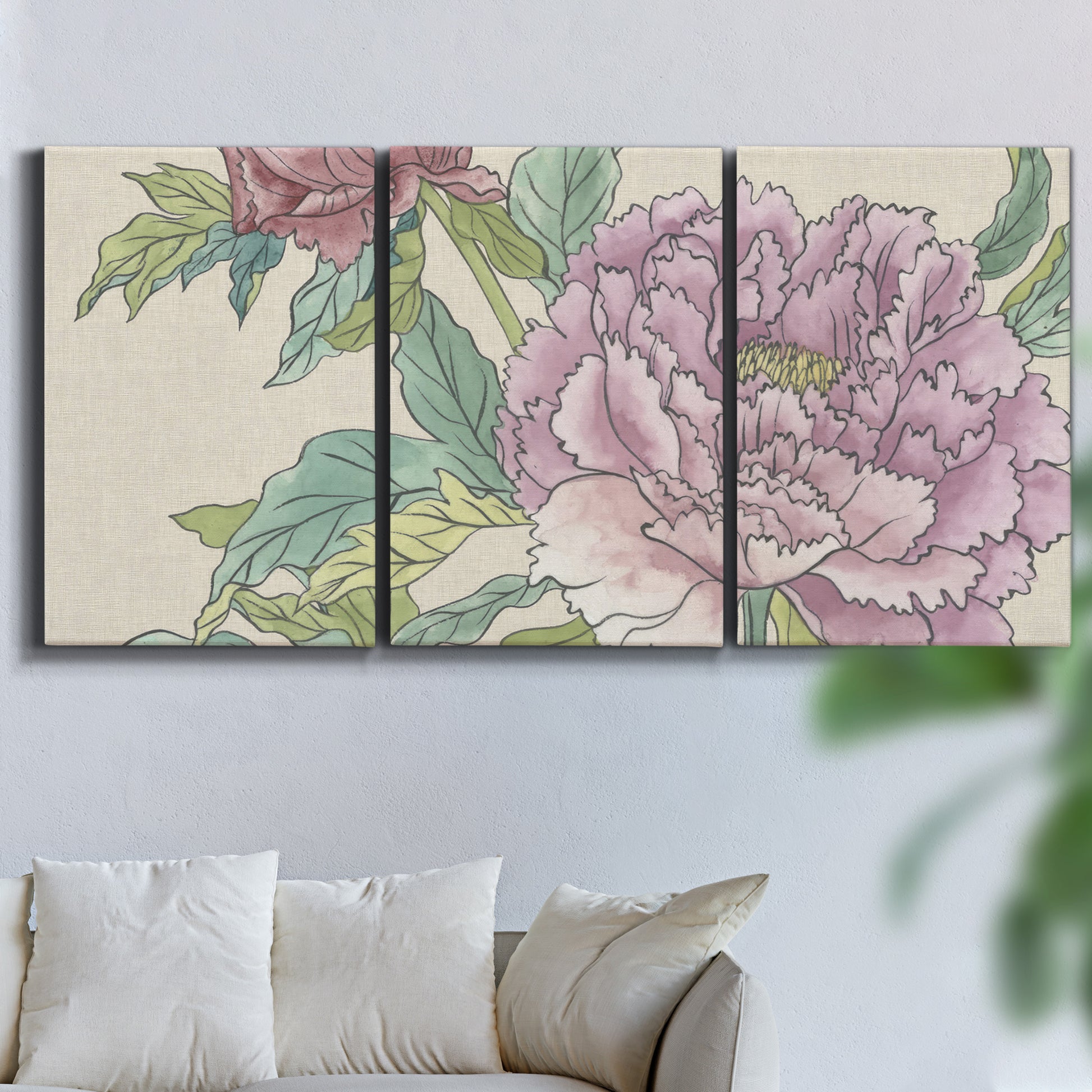 Three-panel canvas wall art featuring soft pink peony blossoms, displayed in a living room above a sofa.