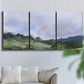 Three-panel canvas wall art featuring wide open pastoral horizon landscape, displayed in a living room above a sofa.
