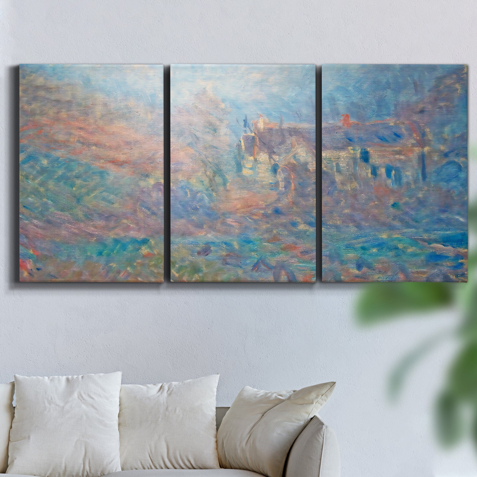 Three-panel canvas wall art featuring sunlit valley landscape, displayed in a living room above a sofa.