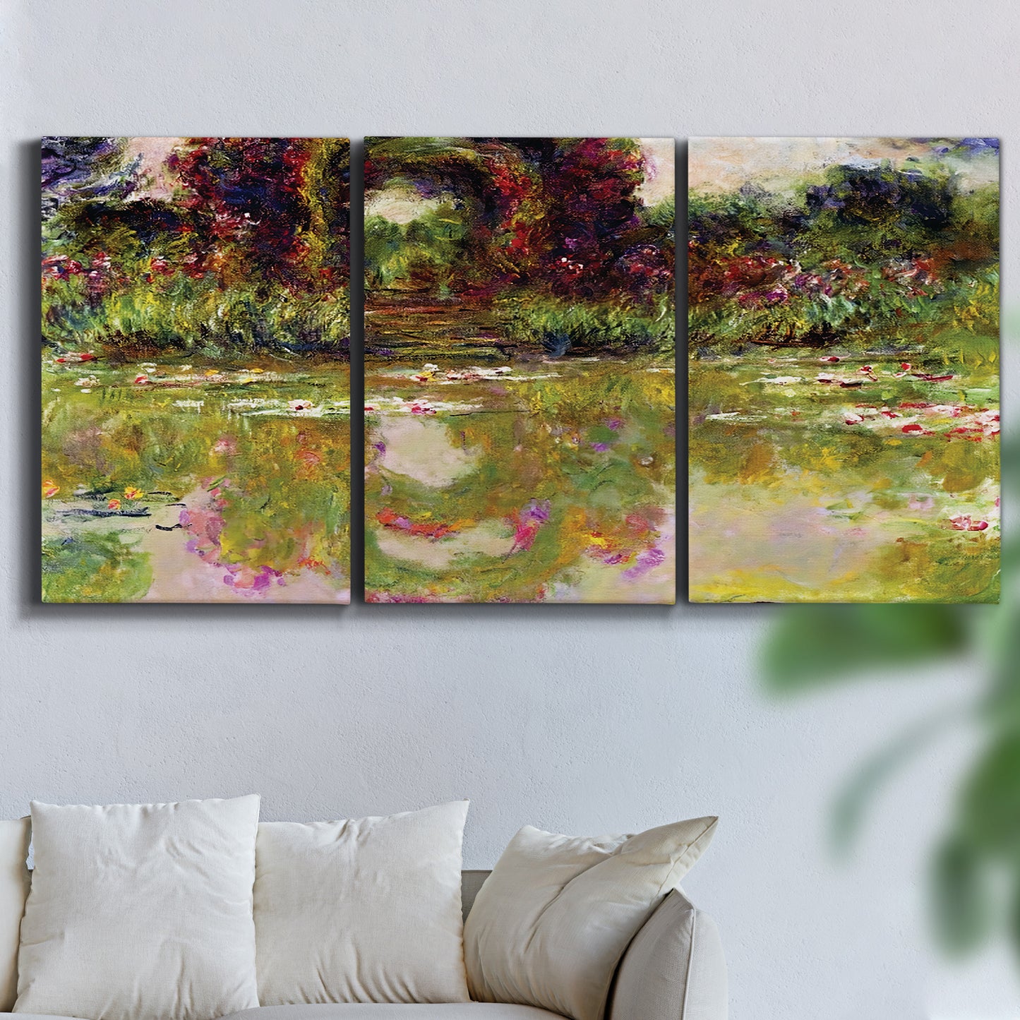 Three-panel canvas wall art featuring arched rose garden walkway, displayed in a living room above a sofa.