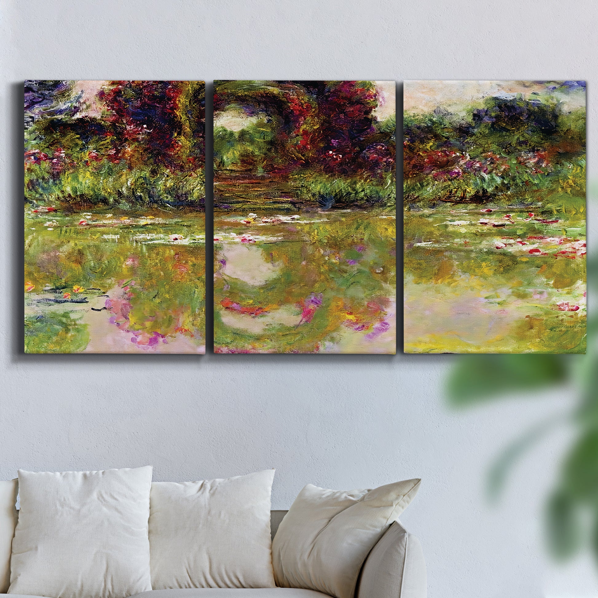 Three-panel canvas wall art featuring arched rose garden walkway, displayed in a living room above a sofa.