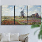 Three-panel canvas wall art featuring tulip fields with windmill, displayed in a living room above a sofa.