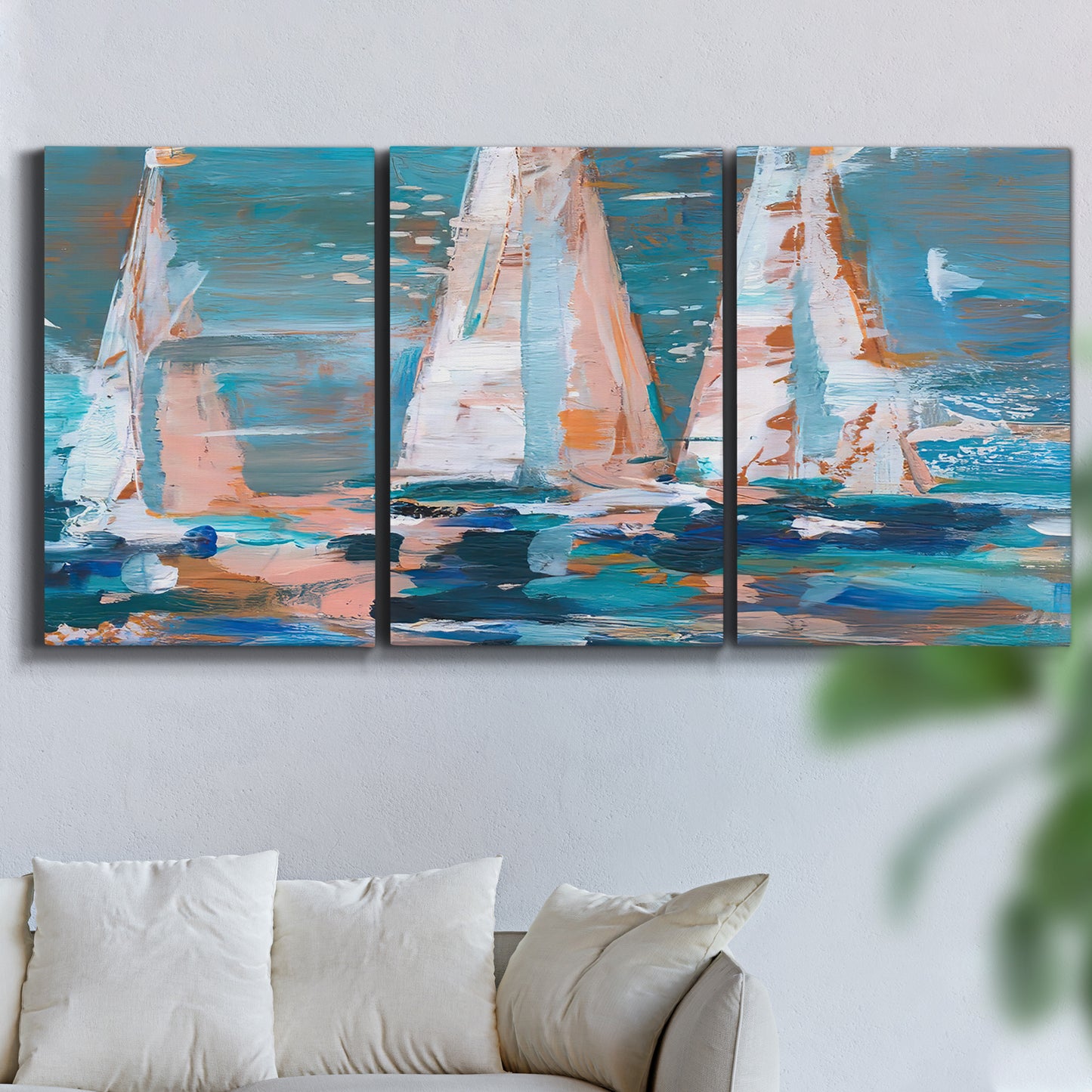 Three-panel canvas wall art featuring graphic pop style sailboats, displayed in a living room above a sofa.