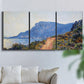 Three-panel canvas wall art featuring winding coastal road above sea, displayed in a living room above a sofa.