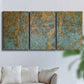Three-panel canvas wall art featuring earthy copper toned abstract, displayed in a living room above a sofa.