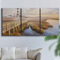 Three-panel canvas wall art featuring coastal path along dunes, displayed in a living room above a sofa.