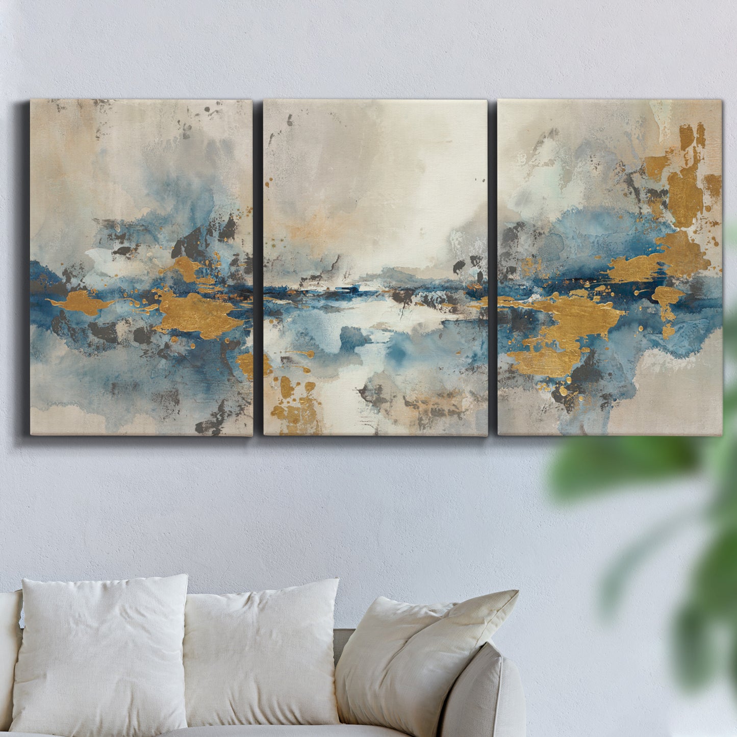 Three-panel canvas wall art featuring abstract soft morning light, displayed in a living room above a sofa.