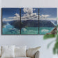 Three-panel canvas wall art featuring tropical water reflections with foliage, displayed in a living room above a sofa.