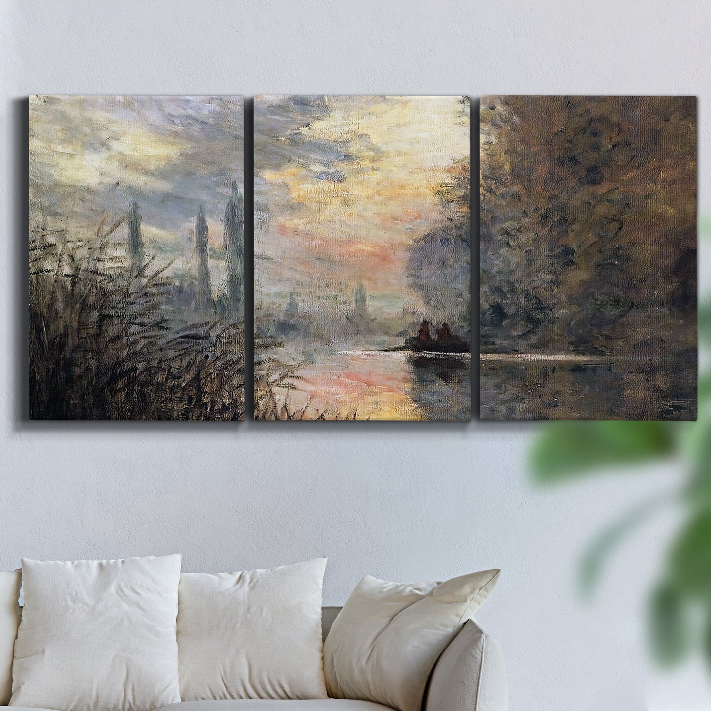Three-panel canvas wall art featuring winter river sunset with reflections, displayed in a living room above a sofa.
