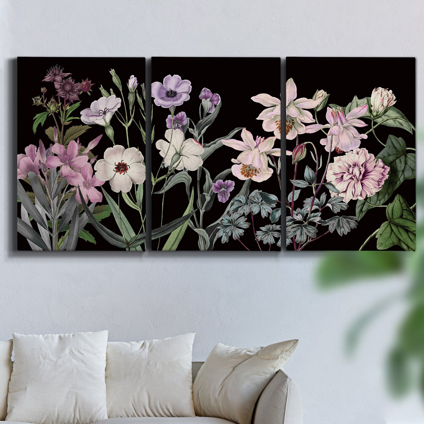 Three-panel canvas wall art featuring early spring blossoms in soft tones, displayed in a living room above a sofa.