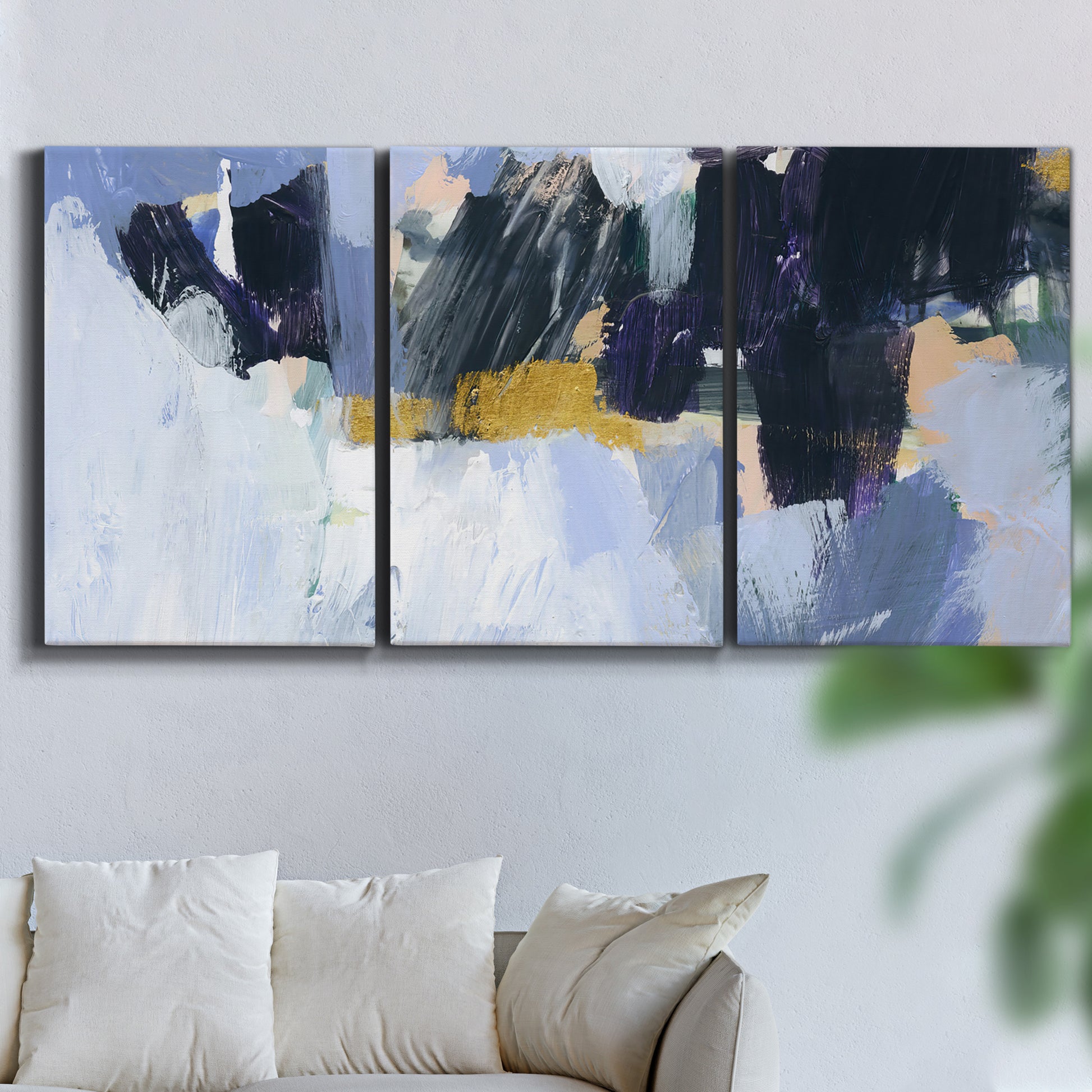 Three-panel canvas wall art featuring icy abstract arctic ledge, displayed in a living room above a sofa.