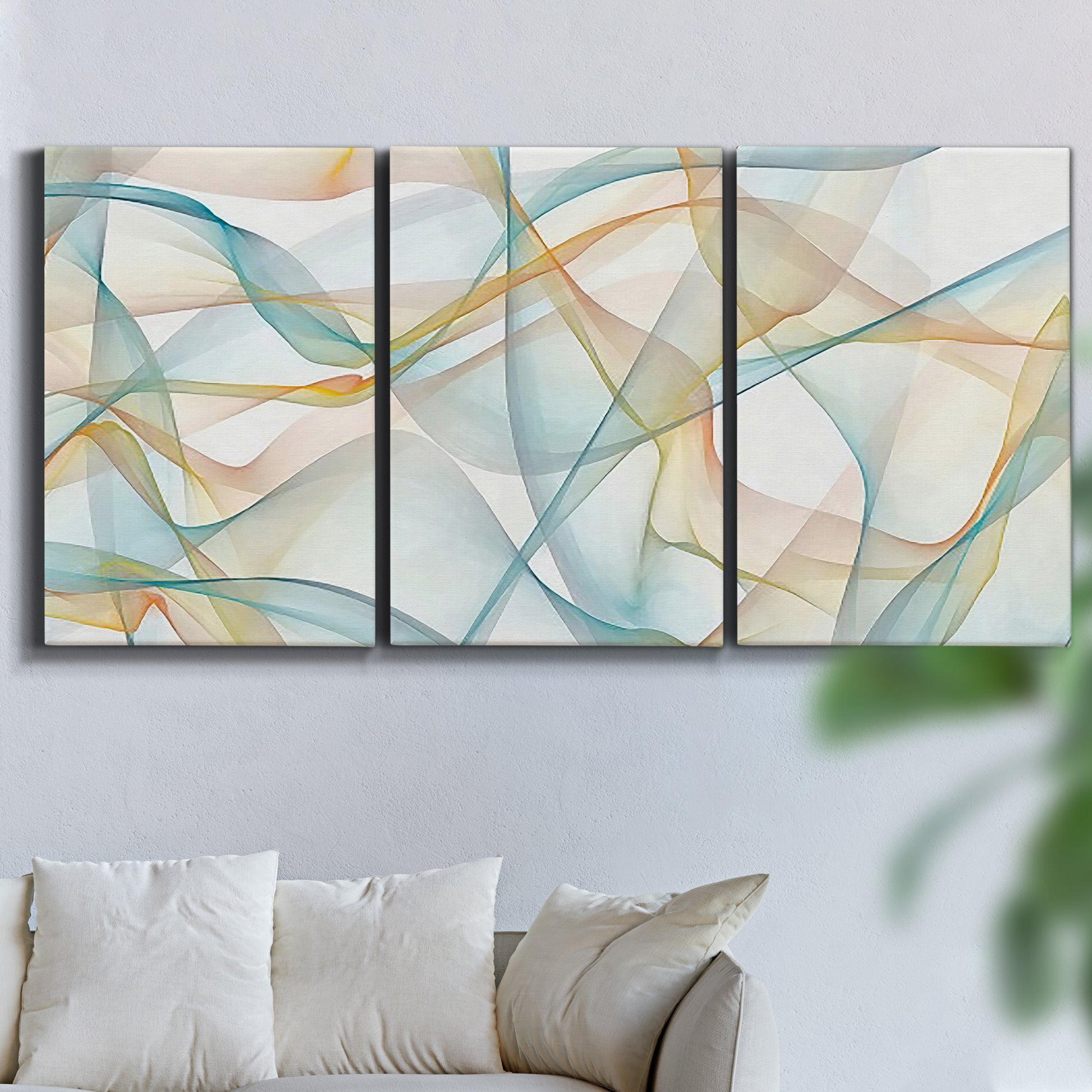 Three-panel canvas wall art featuring flowing abstract curves and wave patterns, displayed in a living room above a sofa.
