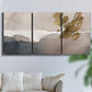 Three-panel canvas wall art featuring abstract watercolor with gold accents, displayed in a living room above a sofa.