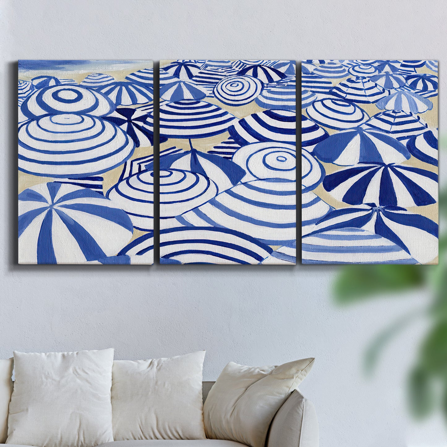 Three-panel canvas wall art featuring geometric abstract bowl forms, displayed in a living room above a sofa.