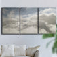 Three-panel canvas wall art featuring aerial landscape view photograph, displayed in a living room above a sofa.