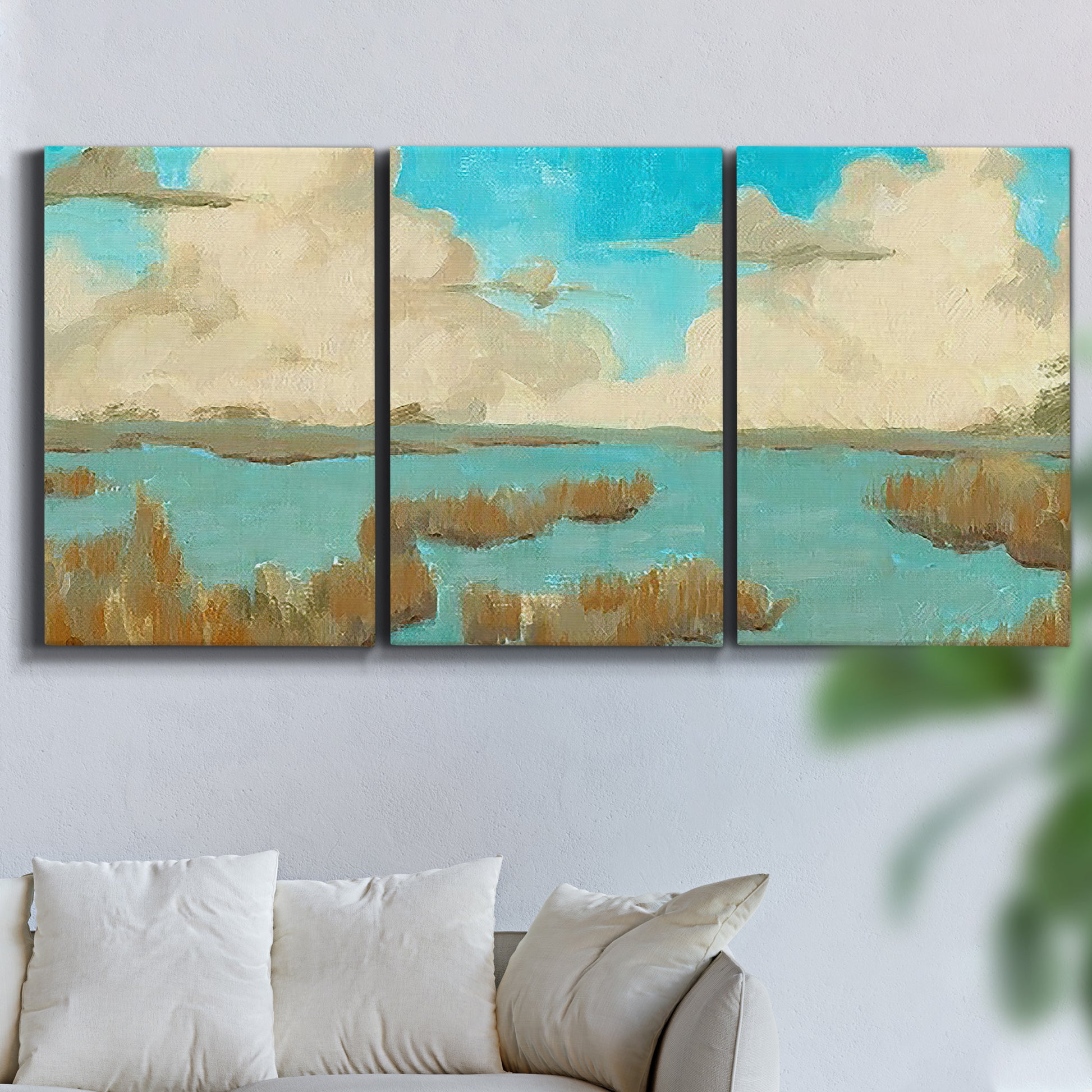 Three-panel canvas wall art featuring abstract pond scene with reflections, displayed in a living room above a sofa.
