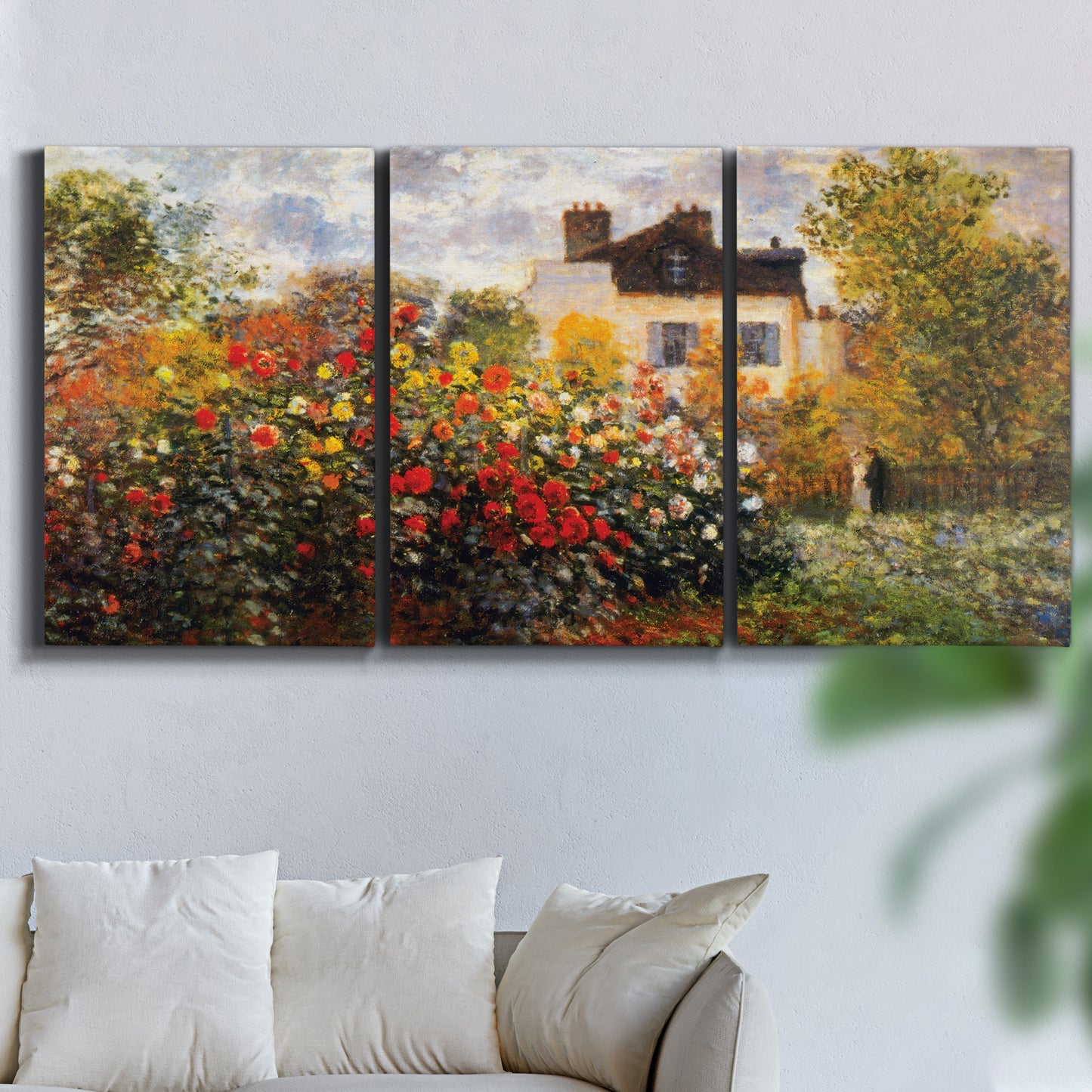 Three-panel canvas wall art featuring farm buildings in rural normandy, displayed in a living room above a sofa.