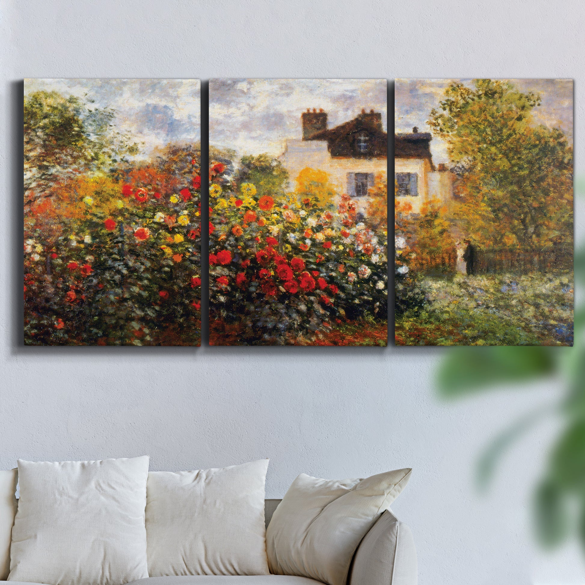 Three-panel canvas wall art featuring farm buildings in rural normandy, displayed in a living room above a sofa.