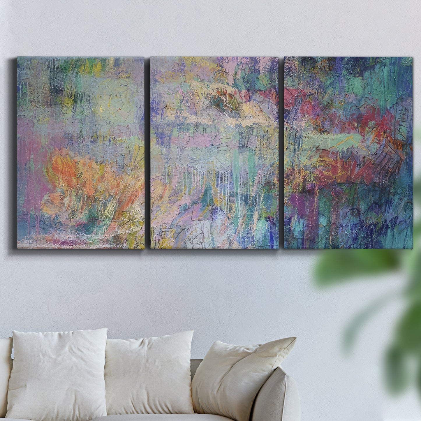 Three-panel canvas wall art featuring abstract evening landscape with depth, displayed in a living room above a sofa.
