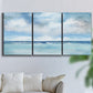 Three-panel canvas wall art featuring tropical clouds over ocean horizon, displayed in a living room above a sofa.