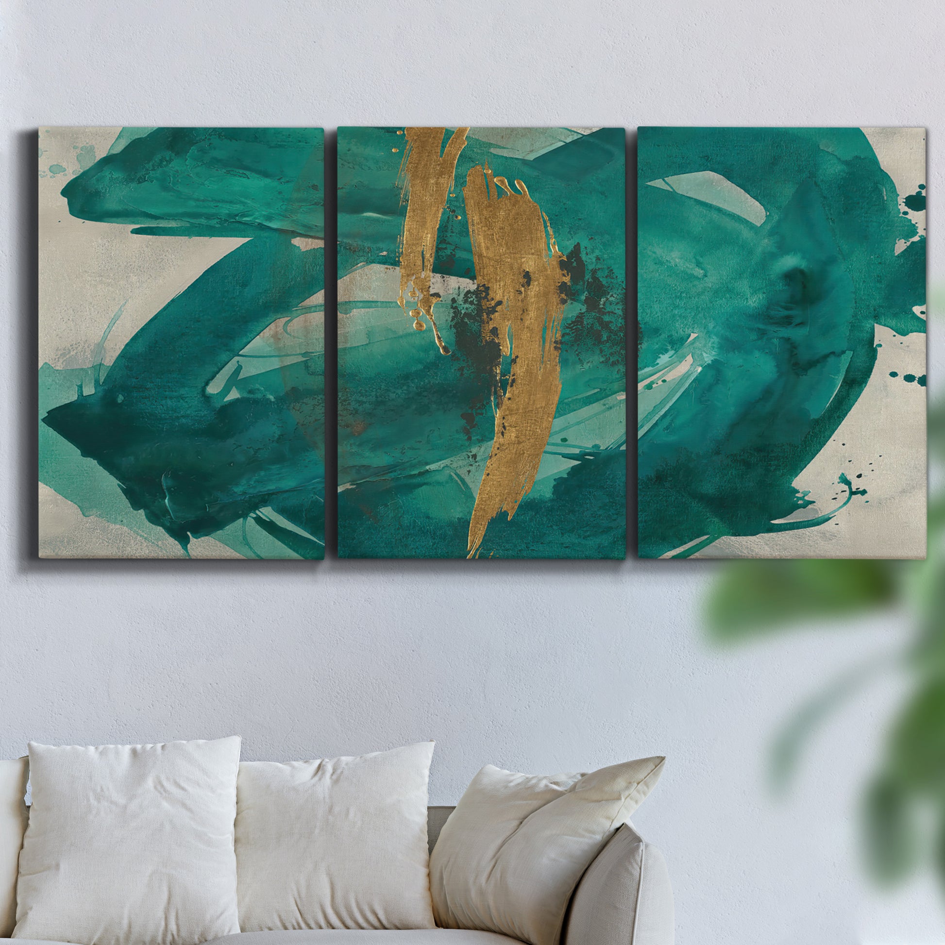 Three-panel canvas wall art featuring interconnected abstract flowing forms, displayed in a living room above a sofa.