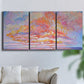 Three-panel canvas wall art featuring peaceful tropical inspired landscape, displayed in a living room above a sofa.